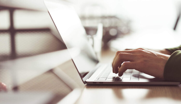 millennial-guy-working-on-his-laptop-2210×1473